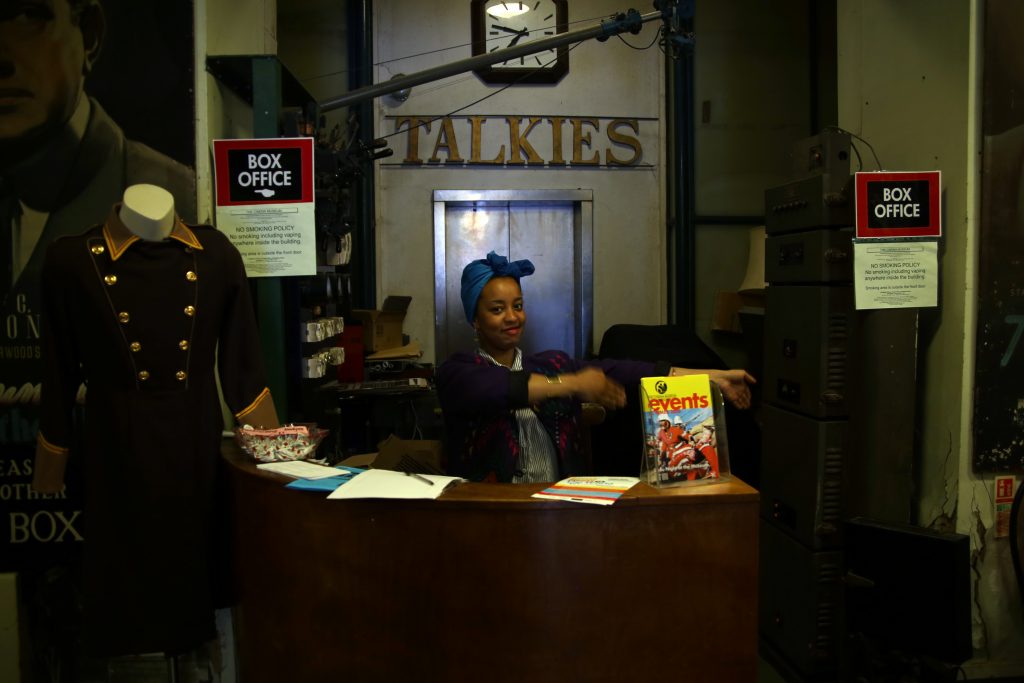 Greeter at a desk at the Cinema Museum